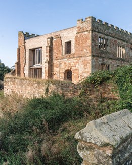 Exterior of Astley Castle against a blue sky