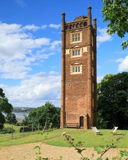 A tudor tower on the shore of an estuary