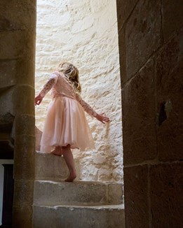 A child climbing a spiral staircase