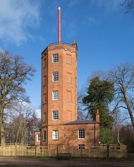 A tall tower surrounded by trees
