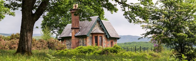 A small Victorian lodge surrounded by Scottish landscape
