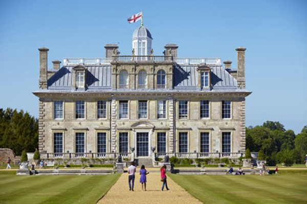 Baroque-style building Kingston Lacey with it's drive and flags flying