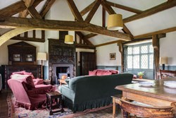 Bromfield Priory Gatehouse int living space with fire 1200x800