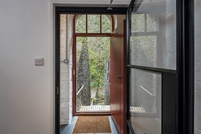 Danescombe Mine interior hallway with modern glass door