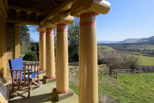 The Pigsty in Yorkshire, view across terrace and through painted columns